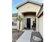 The front of a house with a custom security door and a bench at 861 E Toledo St, Gilbert, AZ 85295