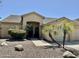 A single story home with desert landscaping and a tile roof at 861 E Toledo St, Gilbert, AZ 85295