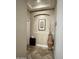 Hallway featuring decorative niche, stylish decor, and tiled floors at 861 E Toledo St, Gilbert, AZ 85295
