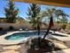 Inviting kidney-shaped pool with surrounding patio at 861 E Toledo St, Gilbert, AZ 85295