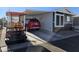 Modern manufactured home with carport and golf cart at 8700 E University Dr # 2405, Mesa, AZ 85207