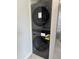 Stackable LG washer and dryer in a modern, efficient laundry closet at 10115 E Mountain View Rd # 2065, Scottsdale, AZ 85258