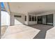 Spacious covered patio with sliding glass doors leading to the inside at 1113 E La Mirada Dr, Phoenix, AZ 85042