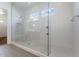 Modern bathroom with a glass-enclosed shower featuring white subway tiles and stylish fixtures at 1113 E La Mirada Dr, Phoenix, AZ 85042