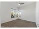 Bright bedroom with two large windows and ceiling fan at 1113 E La Mirada Dr, Phoenix, AZ 85042