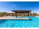 Inviting community pool with a covered patio area and seating at 1113 E La Mirada Dr, Phoenix, AZ 85042