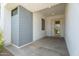 Covered entryway features modern architecture with clean lines and a yellow front door at 1113 E La Mirada Dr, Phoenix, AZ 85042