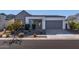 Modern home with gray and white exterior, landscaping, and two-car garage at 1113 E La Mirada Dr, Phoenix, AZ 85042