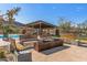 Community fire pit with seating and a covered patio at 1113 E La Mirada Dr, Phoenix, AZ 85042