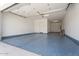 A spacious garage with epoxy flooring and ample room for storage at 1113 E La Mirada Dr, Phoenix, AZ 85042