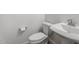 Half bathroom with modern toilet and sink, providing a convenient space at 1113 E La Mirada Dr, Phoenix, AZ 85042