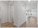 Light and airy hallway with wood-look tile flooring at 1113 E La Mirada Dr, Phoenix, AZ 85042