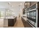 Gourmet kitchen with large island, stainless steel appliances, and ample cabinet space at 1113 E La Mirada Dr, Phoenix, AZ 85042