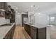 Modern kitchen with dark cabinetry and quartz countertops at 1113 E La Mirada Dr, Phoenix, AZ 85042