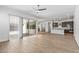 Open living room with tile floors and access to the kitchen and backyard at 1113 E La Mirada Dr, Phoenix, AZ 85042