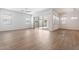 Bright, open living room features wood-look floors and sliding doors to outdoor patio at 1113 E La Mirada Dr, Phoenix, AZ 85042