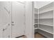 Walk-in pantry with shelving and wood flooring at 1113 E La Mirada Dr, Phoenix, AZ 85042
