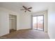 Bedroom with sliding glass door to balcony and closet at 11640 N 51St Ave # 212, Glendale, AZ 85304