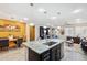 Kitchen with granite island, stainless steel appliances, and dark cabinets at 12756 W Caraveo Pl, Peoria, AZ 85383