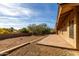 Landscaped backyard with patio and gravel at 15655 E Richwood Ave, Fountain Hills, AZ 85268