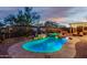 Stunning pool and spa with stone accents and lighting at 17679 W Redwood Ln, Goodyear, AZ 85338