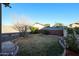 Landscaped backyard with grassy lawn and mature trees at 21925 N 78Th Dr, Peoria, AZ 85383