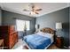 Bright bedroom with a double bed and ceiling fan at 21925 N 78Th Dr, Peoria, AZ 85383