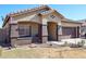 One-story house with a brown door and attached garage at 21925 N 78Th Dr, Peoria, AZ 85383