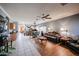 Spacious living room with hardwood floors and ceiling fan at 21925 N 78Th Dr, Peoria, AZ 85383