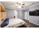 Main bedroom with walk-in closet and ceiling fan at 21925 N 78Th Dr, Peoria, AZ 85383