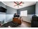 Home office features a large desk and plenty of natural light at 21925 N 78Th Dr, Peoria, AZ 85383
