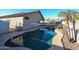 Private backyard pool and spa with a volleyball net at 21925 N 78Th Dr, Peoria, AZ 85383