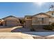 Craftsman style home with stone accents and a 3-car garage at 22091 E Russet Rd, Queen Creek, AZ 85142