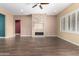 Spacious living room featuring a stone fireplace at 22091 E Russet Rd, Queen Creek, AZ 85142