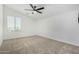 Bright bedroom with a ceiling fan and neutral decor at 22235 E Munoz Ct, Queen Creek, AZ 85142