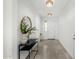 Bright entryway with tile flooring, a console table, and a large mirror at 22235 E Munoz Ct, Queen Creek, AZ 85142
