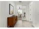 Bright hallway with tile flooring and built-in storage at 22235 E Munoz Ct, Queen Creek, AZ 85142
