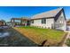 House exterior showcasing backyard and covered patio at 22235 E Munoz Ct, Queen Creek, AZ 85142