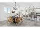 Modern kitchen with white cabinets, large island, and pendant lighting at 22235 E Munoz Ct, Queen Creek, AZ 85142