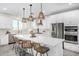 Large kitchen island with seating and plenty of counter space at 22235 E Munoz Ct, Queen Creek, AZ 85142