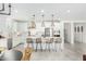 Modern kitchen with white cabinets, a large island, and pendant lighting at 22235 E Munoz Ct, Queen Creek, AZ 85142