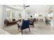 Open concept living room with leather sofas and a view to kitchen at 22235 E Munoz Ct, Queen Creek, AZ 85142