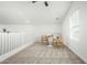 Bright loft with a small table and chairs, carpet and window at 22235 E Munoz Ct, Queen Creek, AZ 85142