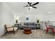 Cozy loft sitting area with gray couch and wooden coffee table at 22235 E Munoz Ct, Queen Creek, AZ 85142