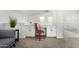 Built-in workspace with white cabinets and red metal chair at 22235 E Munoz Ct, Queen Creek, AZ 85142