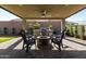 Relaxing patio with fire pit and seating area at 22235 E Munoz Ct, Queen Creek, AZ 85142