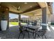 Outdoor patio with table and chairs, perfect for dining al fresco at 22235 E Munoz Ct, Queen Creek, AZ 85142