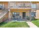 Ground-level patio with seating area, and stairs leading to the entrance at 2406 W Campbell Ave # 143, Phoenix, AZ 85015