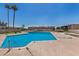 Community swimming pool with surrounding concrete decking at 2406 W Campbell Ave # 143, Phoenix, AZ 85015