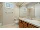 Clean bathroom with wood vanity and tile shower at 2646 E Spring Rd, Phoenix, AZ 85032